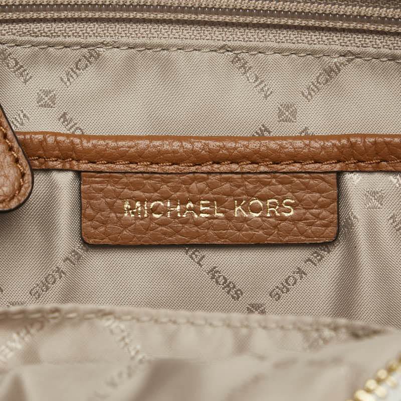 Michael Kors Monogram Studded Backpack PVC Leather in Great Condition