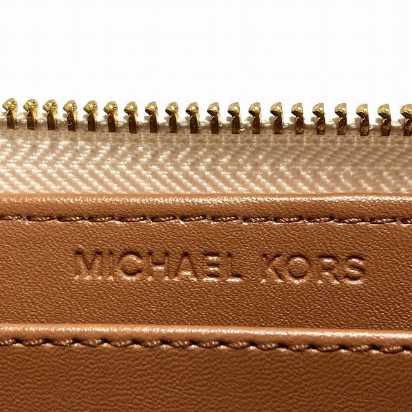 Michael Kors Monogram Round Zip Wallet in Good Condition