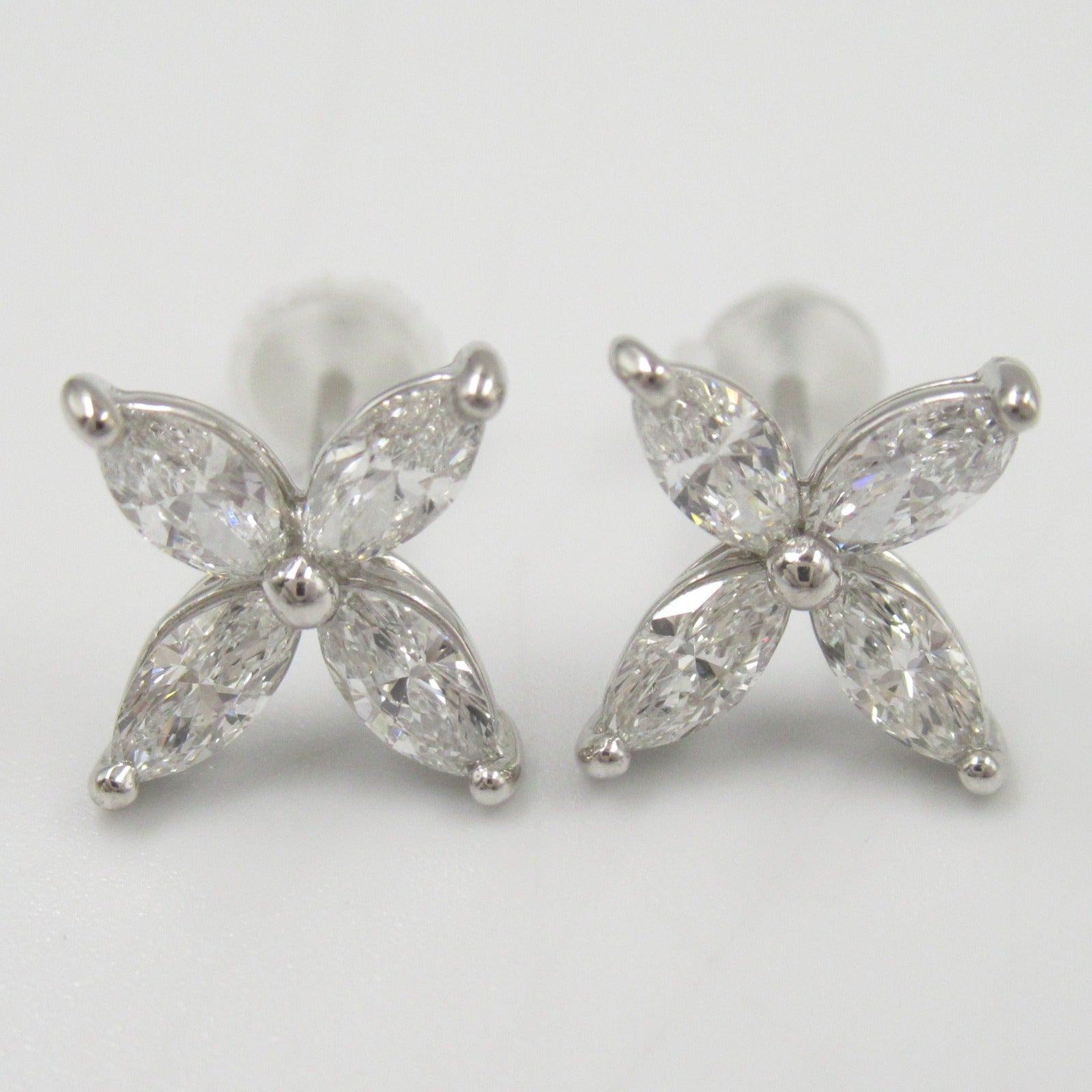 LuxUness Platinum Flower Stud Earrings  Metal Earrings in Great Condition