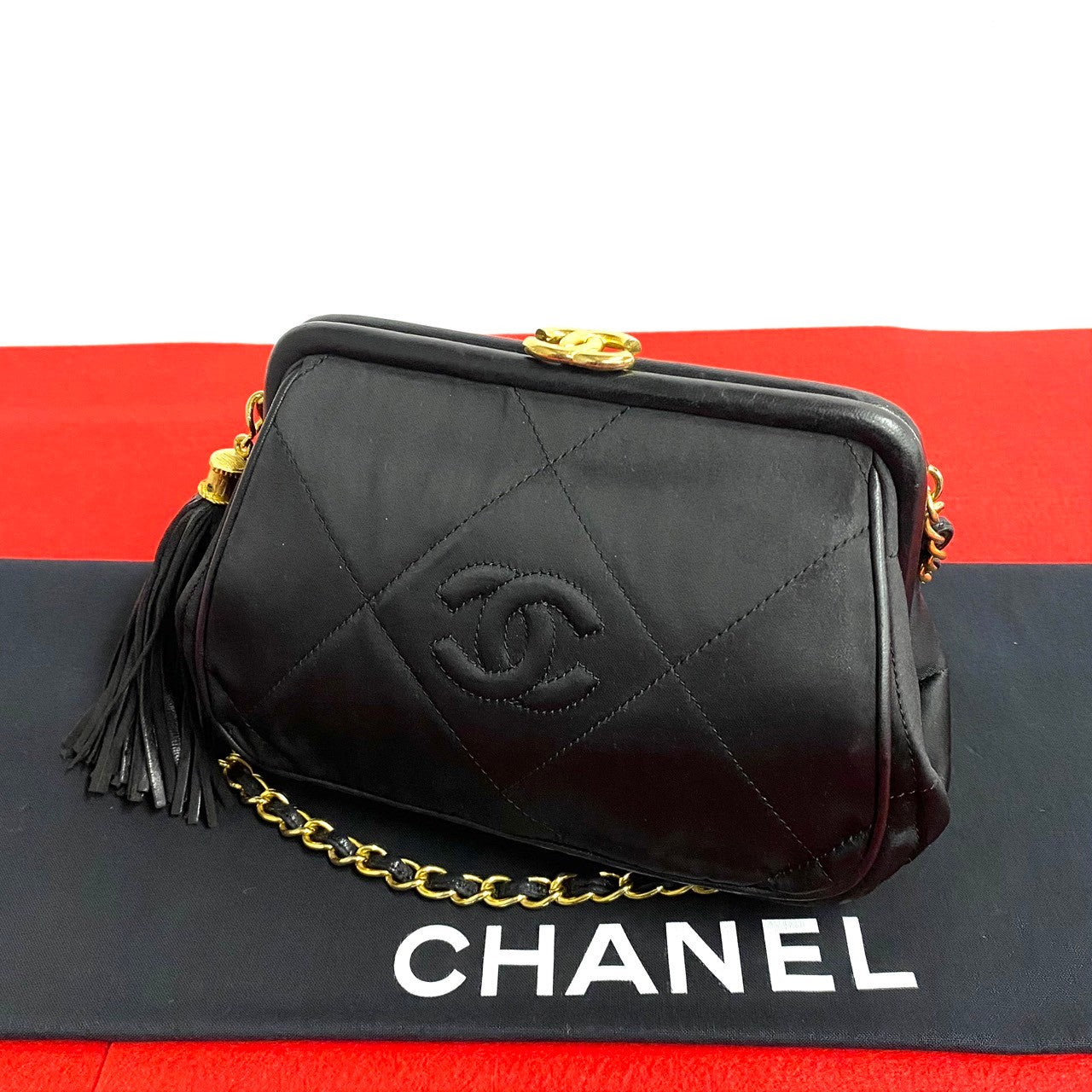 Chanel Quilted Satin Clasp Crossbody Bag Canvas Crossbody Bag in Very Good Condition