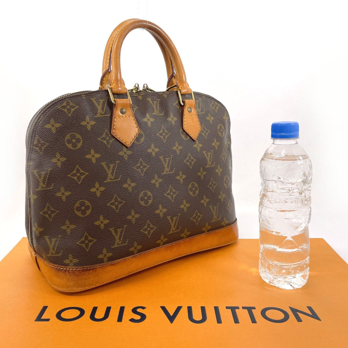 Louis Vuitton Alma Monogram Canvas Handbag