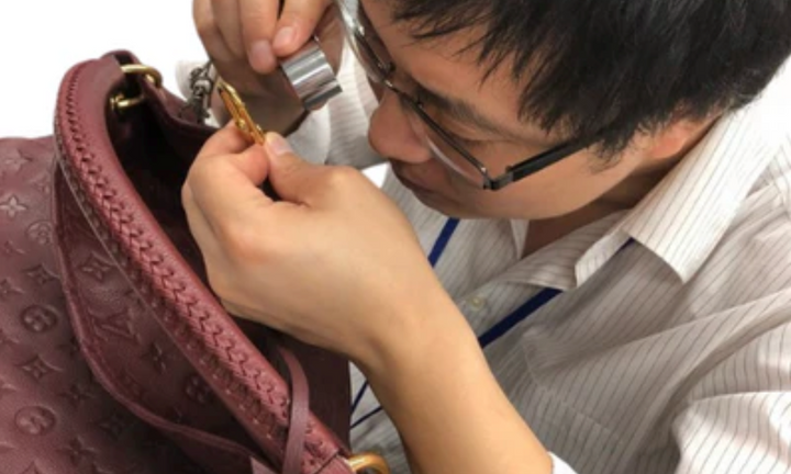 A closer look at the details of a luxury bag during inspection