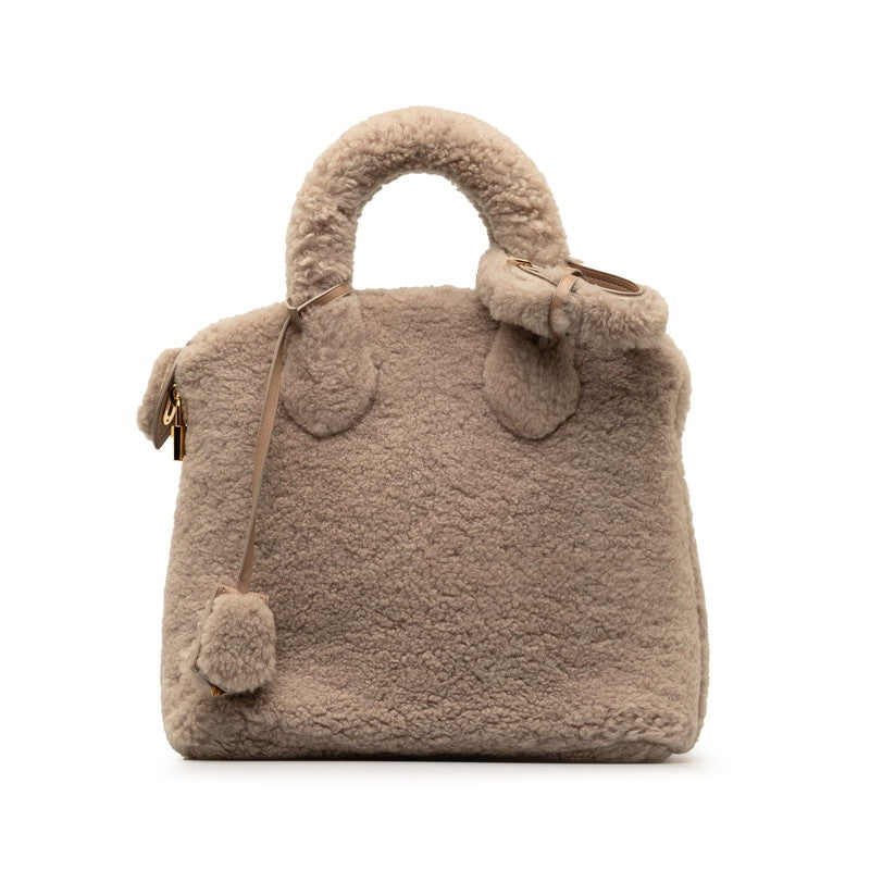 Louis Vuitton Lock It Voyage Canvas Handbag M93850 in Good condition
